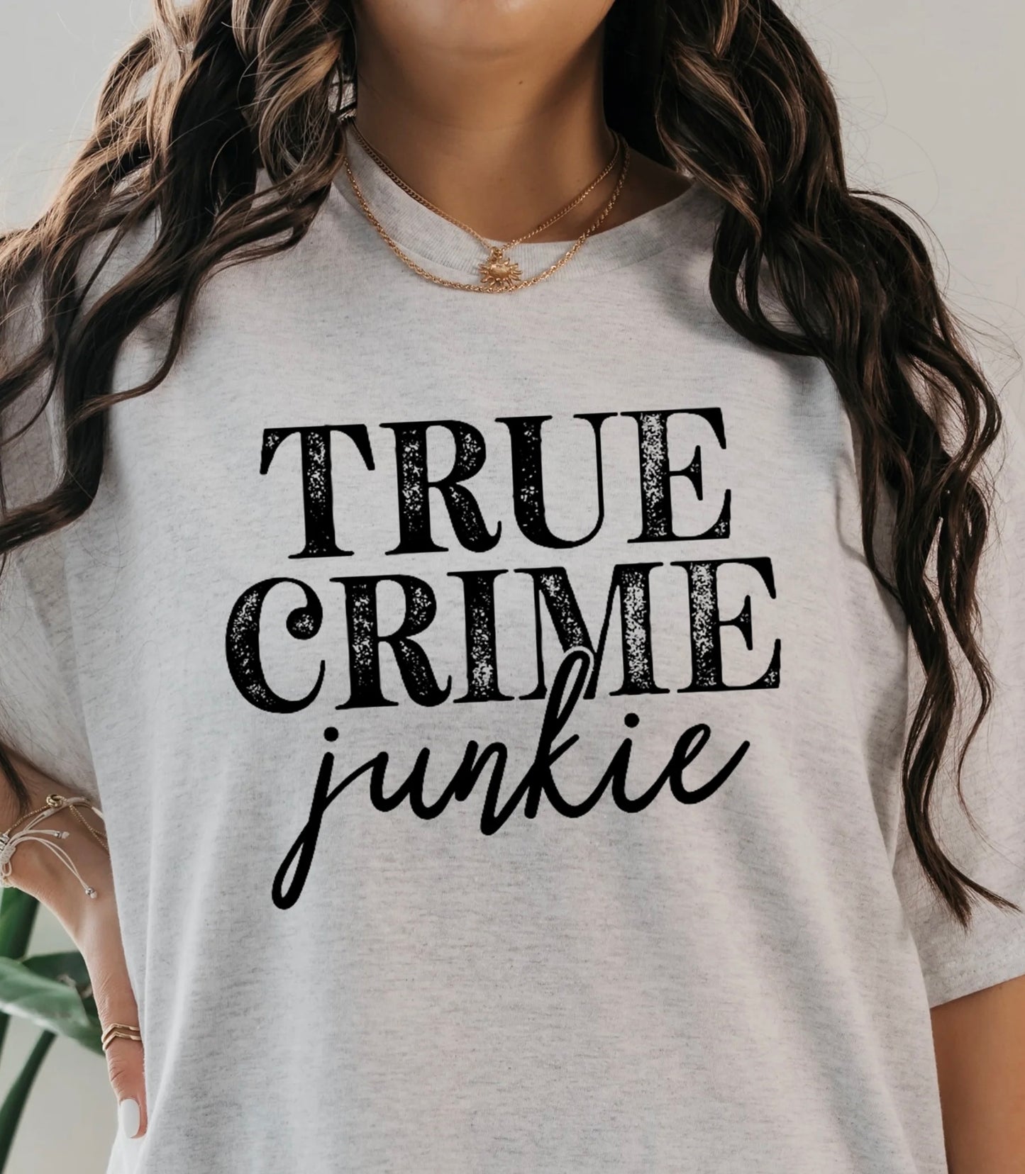 True Crime Junkie red t-shirt for true crime lovers with bold white text – unisex graphic tee for murder mystery and podcast fans.