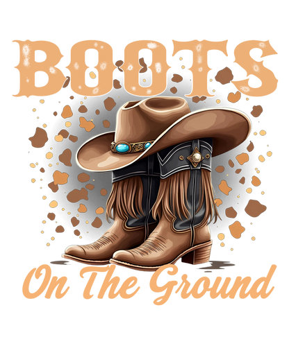 Brown Cowgirl Western “Boots On The Ground” graphic tee design with cowgirls' boots and hat with a rustic country fashion shirt.