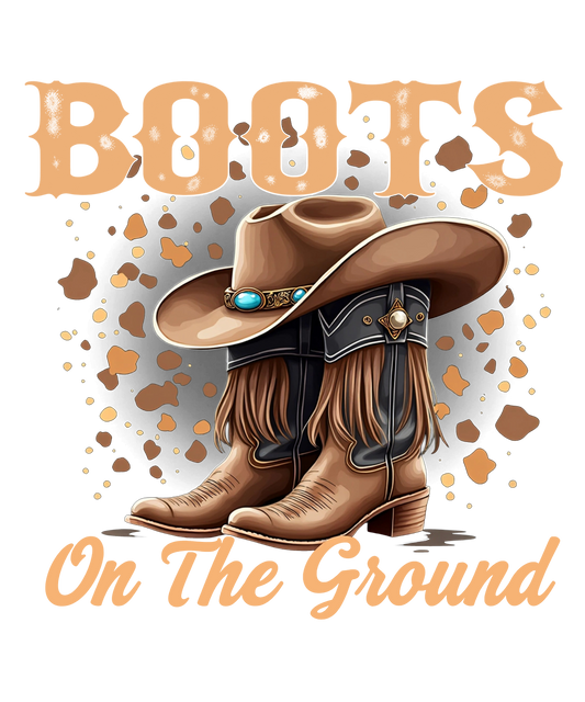 Brown Cowgirl Western “Boots On The Ground” graphic tee design with cowgirls' boots and hat with a rustic country fashion shirt.