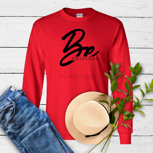 Be Original sweatshirt by LDC Designz featuring bold inspirational text on a red unisex crewneck sweatshirt styled with casual denim for everyday wear.