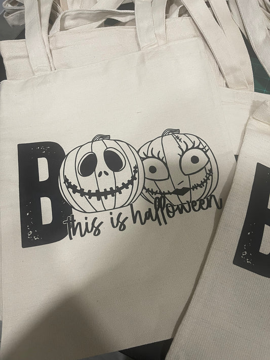 Eco-friendly “Boo This is Halloween” tote bag with spooky text and fall-themed design, perfect for Halloween accessories and trick-or-treating.