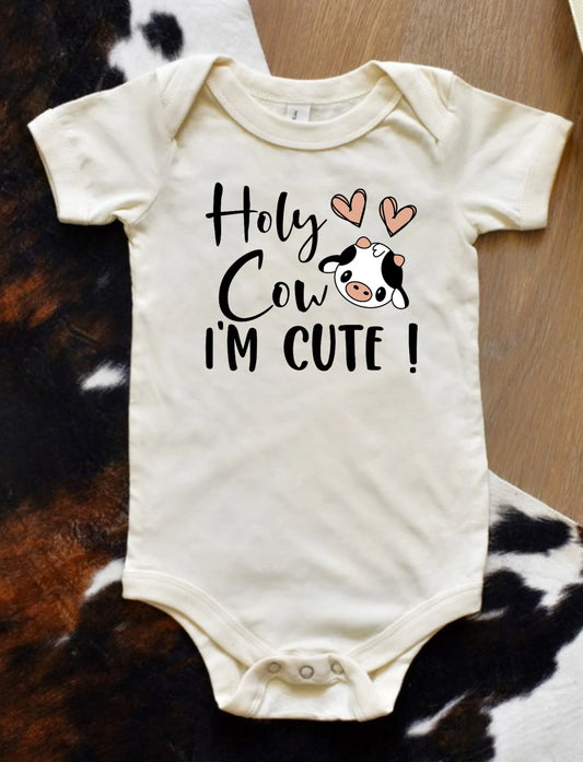 Holy Cow I'm Cute baby onesie – adorable farm-themed infant bodysuit with cow design, soft cotton newborn outfit, perfect baby shower gift from LDC Designz.