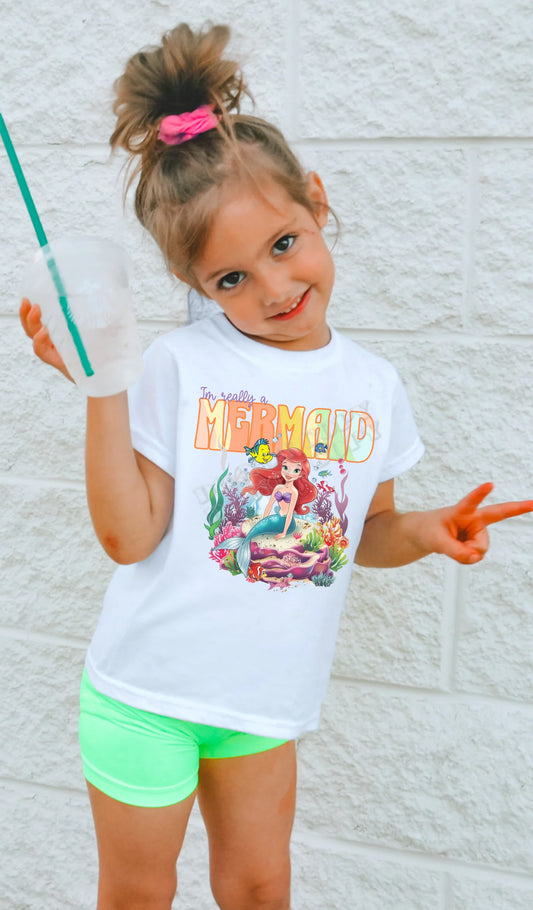 I’m Really a Mermaid T-Shirt for toddlers and youth – cute mermaid graphic tee with vibrant ocean design, perfect for beach days, birthdays, and everyday wear from LDC Designz.