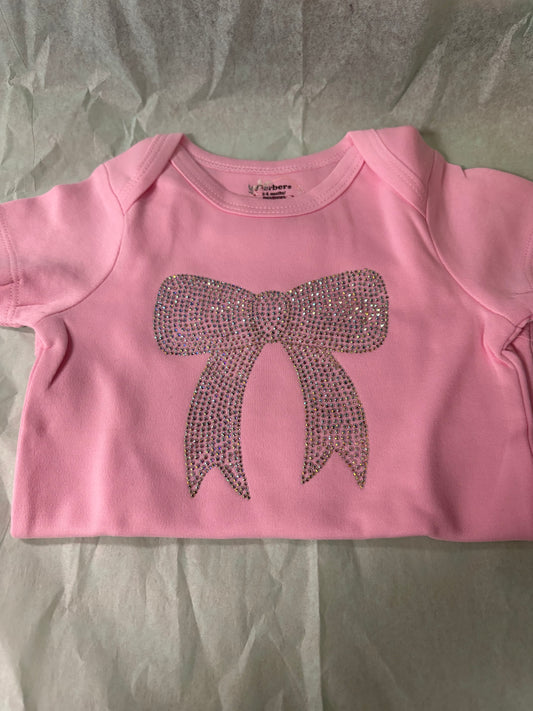 Infant onesie with rhinestone bow design by LDC Designz – soft cotton baby outfit for toddlers and infants featuring sparkling rhinestone accents