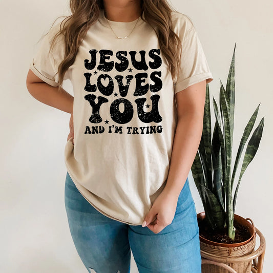 “Jesus Loves You and I’m Trying T-Shirt – Funny Christian Graphic Tee | Faith-Inspired Apparel by LDC Designz”