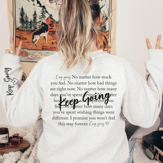 Keep Going Sweatshirt – Inspirational motivational graphic crewneck sweater from LDC Designz, unisex cozy cotton-blend sweatshirt with positive message.
