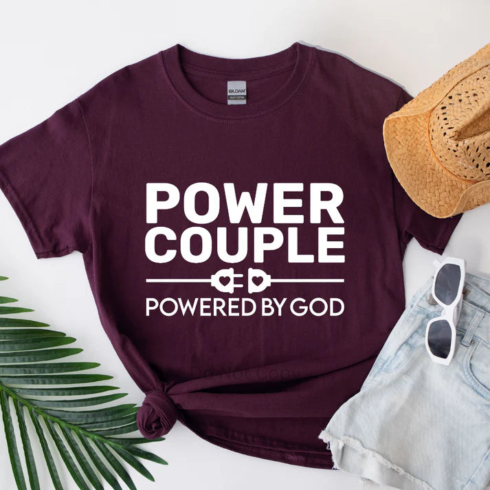 Power Couple Powered by God sweatshirt featuring faith-based Christian design for couples, inspirational unisex apparel by LDC Designz displayed in burgundy color.