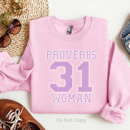 Proverbs 31 Woman Rhinestone Sweatshirt – Christian faith-based sparkle sweatshirt for women by LDC Designz, featuring rhinestone Bible verse design in red, pink, blue, and green colors.