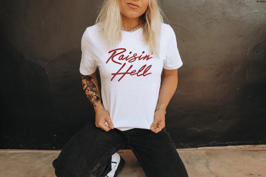 Raising Hell (Red Ink) T-Shirt – edgy unisex graphic tee in bold red lettering, perfect for streetwear, concerts, and festival outfits – LDC Designz.