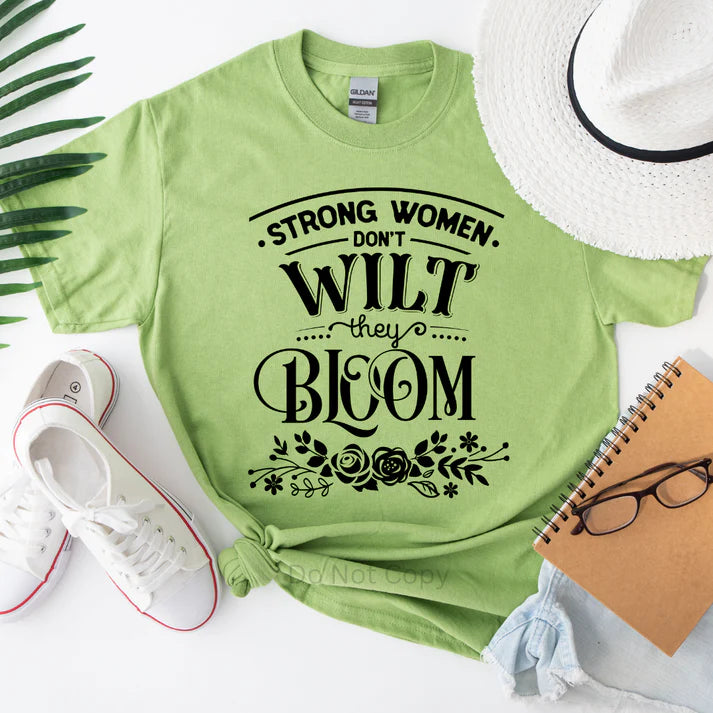 Strong Women Don’t Wilt They Bloom inspirational women’s t-shirt with floral graphic and empowering message, motivational casual tee by LDC Designz