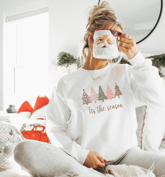 “Tis the Season Sweatshirt – cozy unisex Christmas holiday crewneck with festive design, perfect for winter outfits, holiday parties, and Christmas gift ideas – LDC Designz.”
