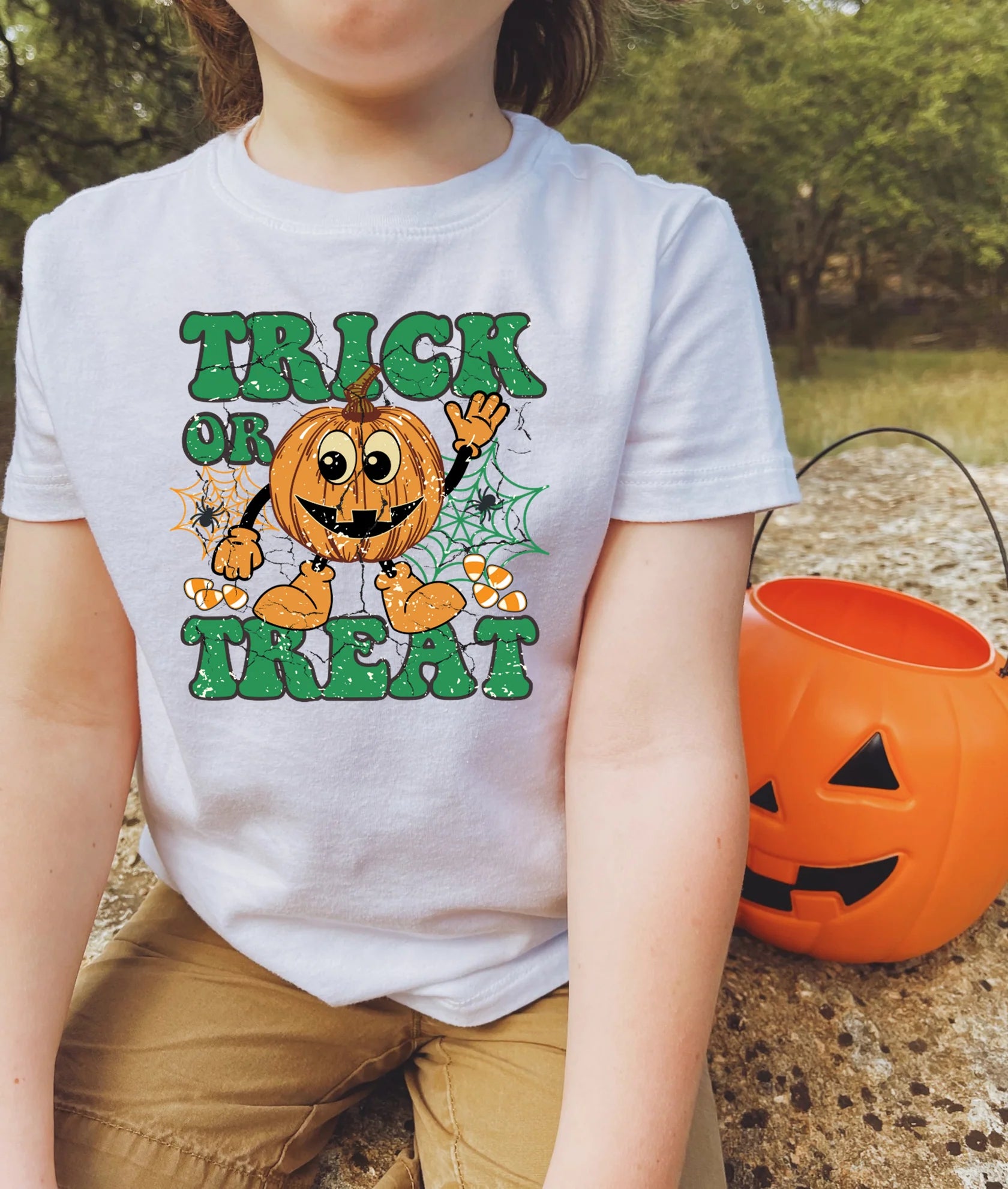Trick or Treat T-Shirt – Custom Halloween graphic tee with spooky design, perfect for kids, toddlers, and adults for Halloween parties and trick-or-treating.