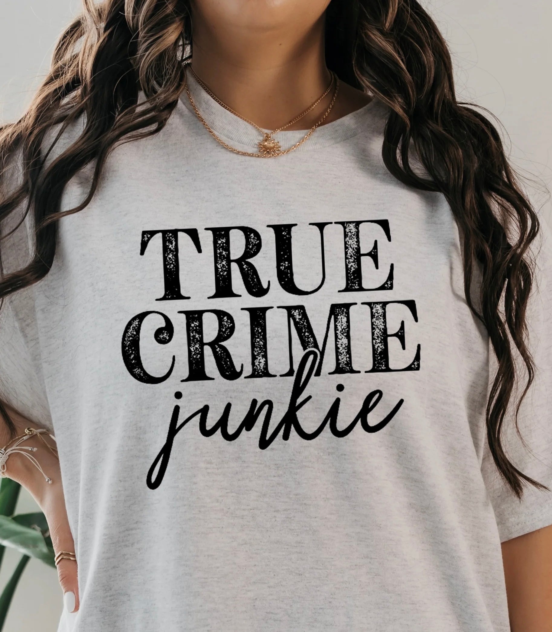 True Crime Junkie red t-shirt for true crime lovers with bold white text – unisex graphic tee for murder mystery and podcast fans.