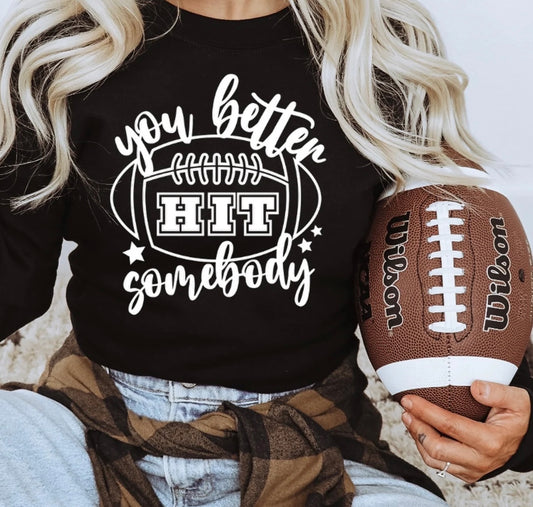 You Better HIT Somebody football T-shirt – bold graphic game day shirt for football fans, coaches, and parents, perfect for sports season and team spirit.