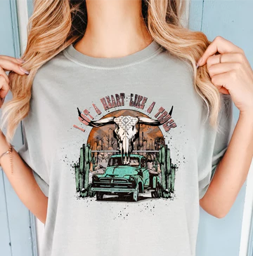 "Heart Like a Truck T-shirt – country music-inspired graphic tee with bold truck and heart design for resilient women and southern fashion lovers"